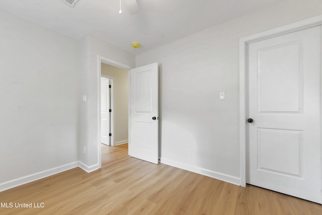 unfurnished bedroom featuring ceiling fan and light hardwood / wood-style floors