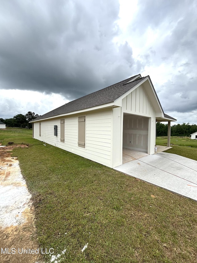 garage with concrete driveway