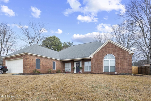 view of front of house featuring a garage and a front yard