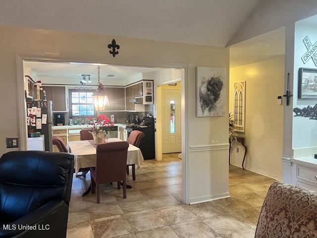 dining room with lofted ceiling