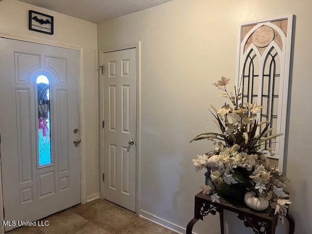 foyer entrance featuring tile patterned floors