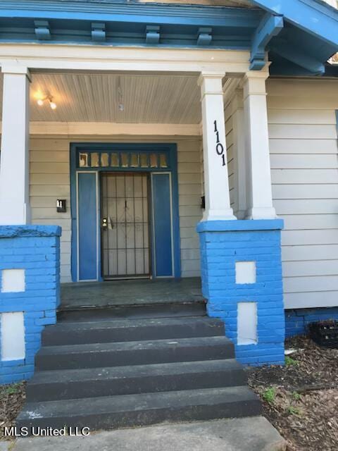 entrance to property with a porch