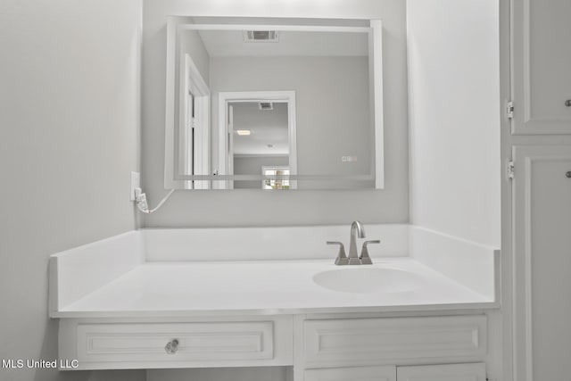 bathroom featuring vanity and visible vents