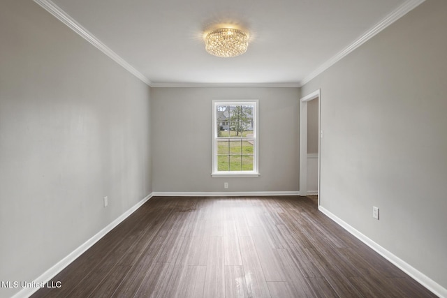 unfurnished room with crown molding, a notable chandelier, dark wood-style floors, and baseboards