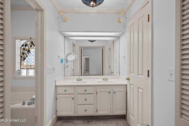 bathroom featuring crown molding, a garden tub, double vanity, and a sink