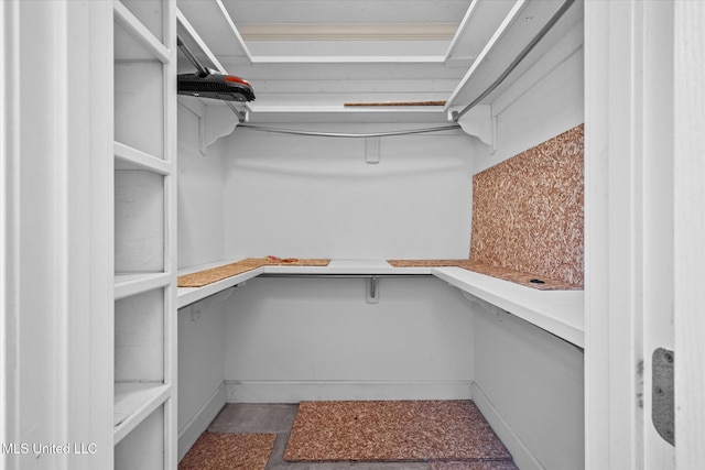 spacious closet featuring built in desk