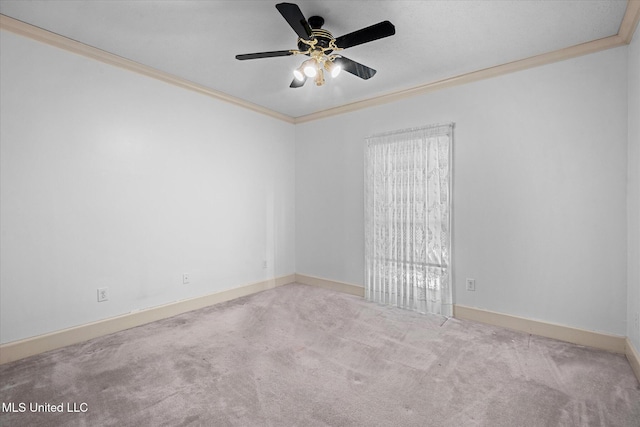 empty room featuring carpet flooring, baseboards, ceiling fan, and ornamental molding