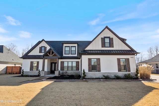 modern inspired farmhouse with a front lawn