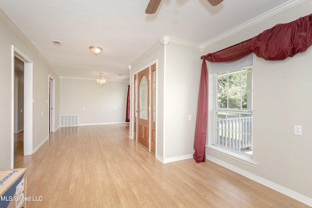 corridor with light hardwood / wood-style flooring and crown molding