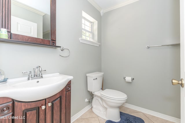 bathroom featuring vanity, ornamental molding, toilet, and tile patterned flooring