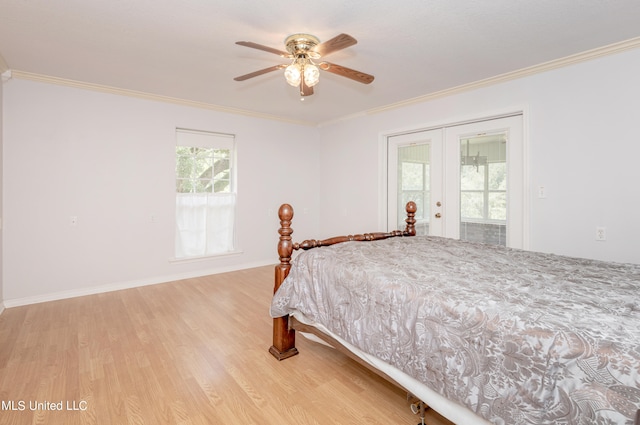 bedroom featuring ceiling fan, access to exterior, light hardwood / wood-style floors, crown molding, and french doors