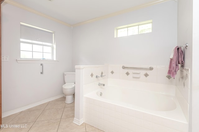 bathroom with toilet, crown molding, tiled tub, and tile patterned floors