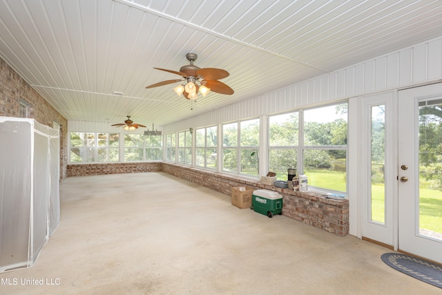 unfurnished sunroom featuring plenty of natural light and ceiling fan