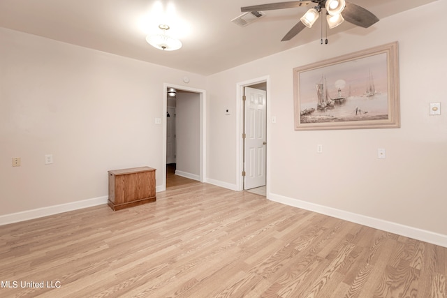 unfurnished room with ceiling fan and light wood-type flooring