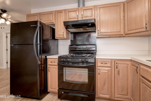 kitchen with ceiling fan, black appliances, light wood-type flooring, and light brown cabinets