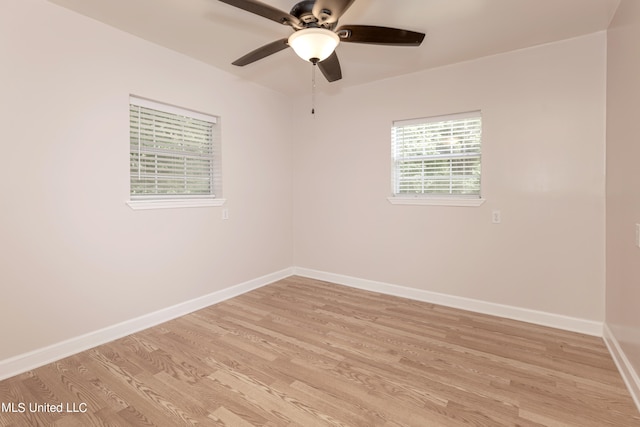 empty room with ceiling fan and light wood-type flooring