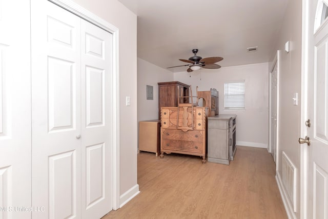 interior space with a closet, light wood-type flooring, and ceiling fan