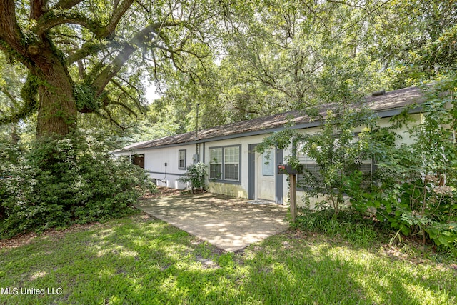 back of house with a yard