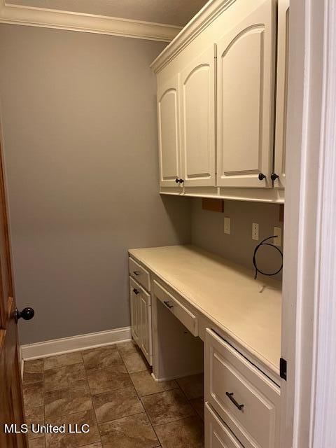 laundry room featuring crown molding