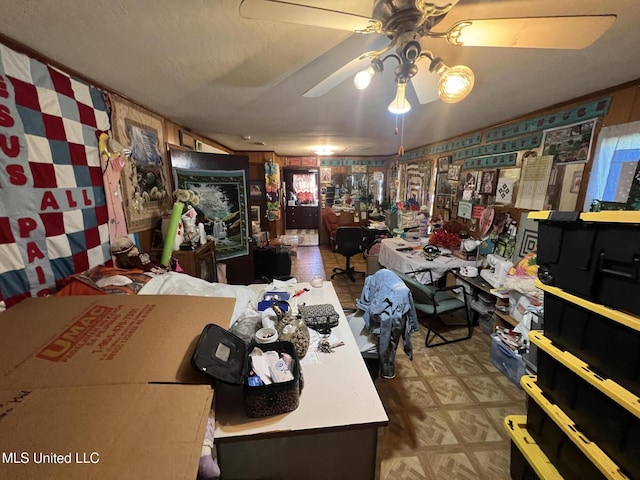 interior space featuring ceiling fan