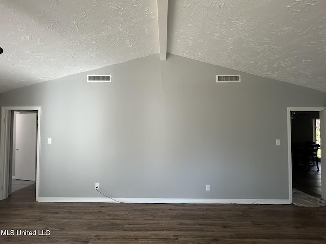 600 Jackson Ave, Mccomb, MS 39648 - unfurnished room featuring a textured ceiling, lofted ceiling, and wood finished floors