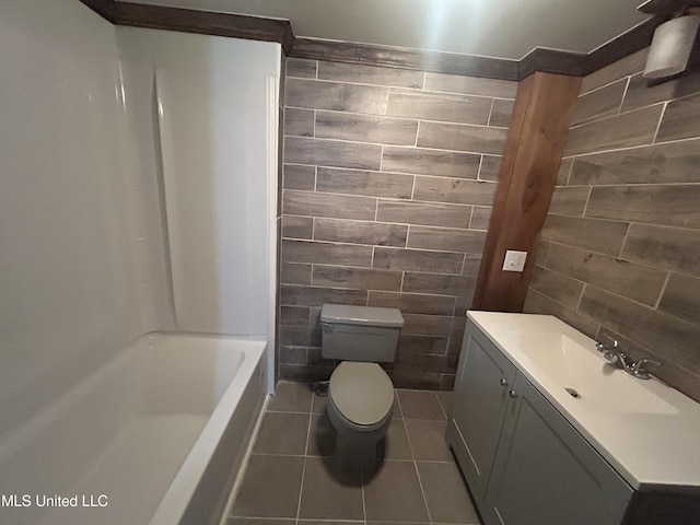 600 Jackson Ave, Mccomb, MS 39648 - full bathroom featuring tile patterned flooring, vanity, and shower / bath combination