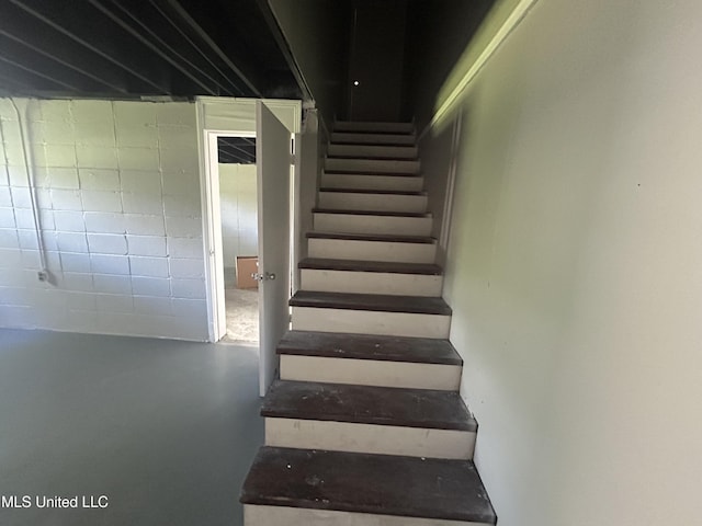 600 Jackson Ave, Mccomb, MS 39648 - staircase with finished concrete flooring