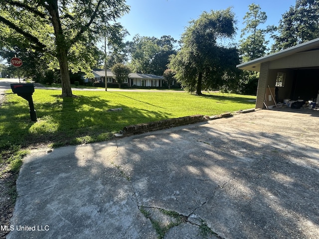 600 Jackson Ave, Mccomb, MS 39648 - view of grassy yard with driveway