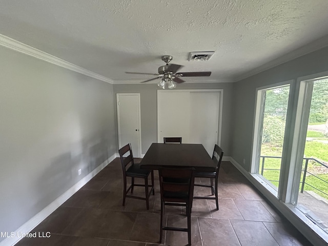 600 Jackson Ave, Mccomb, MS 39648 - dining space featuring plenty of natural light, ornamental molding, ceiling fan, and a textured ceiling
