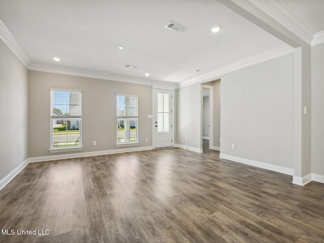 unfurnished living room featuring visible vents, crown molding, and dark wood finished floors