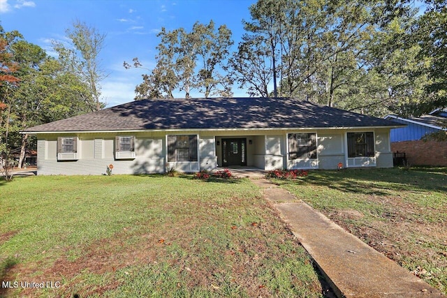 ranch-style home featuring a front yard