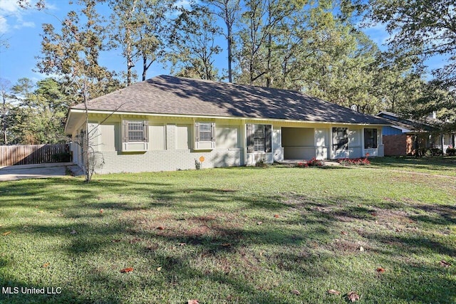 ranch-style house with a front lawn