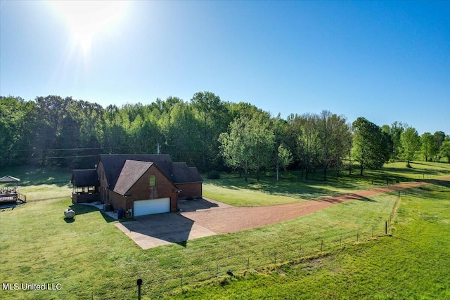 birds eye view of property with a forest view