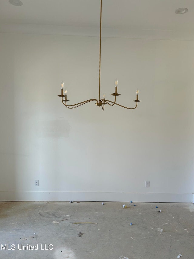 unfurnished room with an inviting chandelier