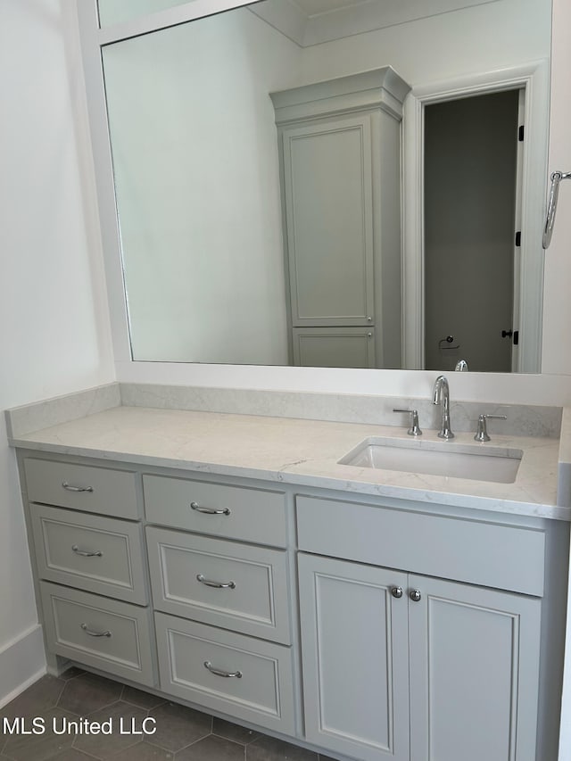 bathroom with tile patterned flooring and vanity