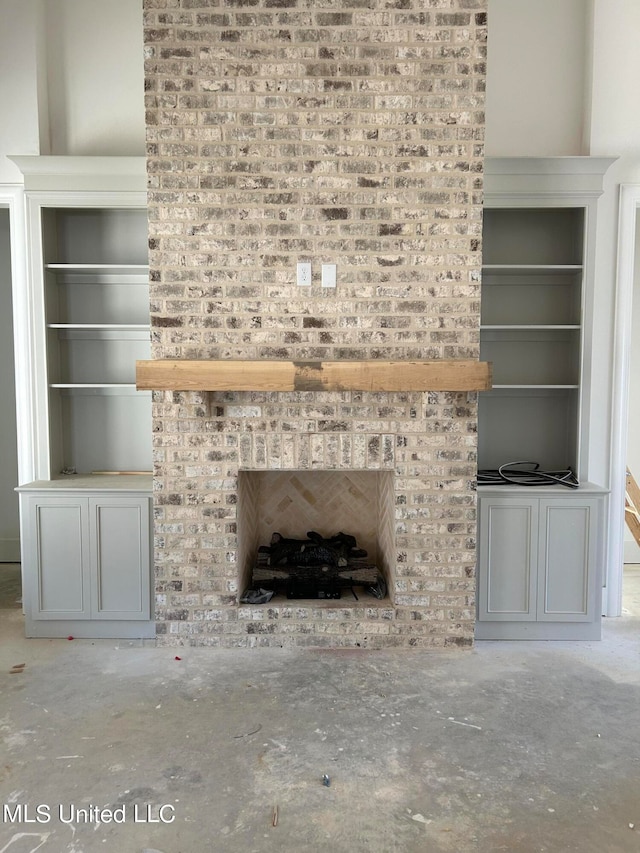 unfurnished living room with a brick fireplace