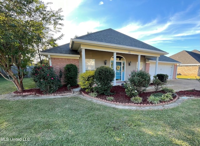 view of front of property with a porch, a garage, and a front yard