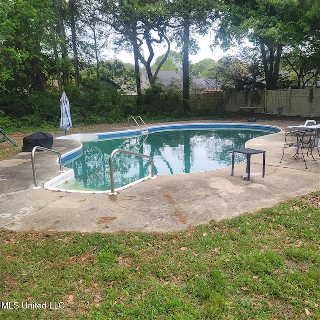 view of pool with fence, a fenced in pool, and a patio