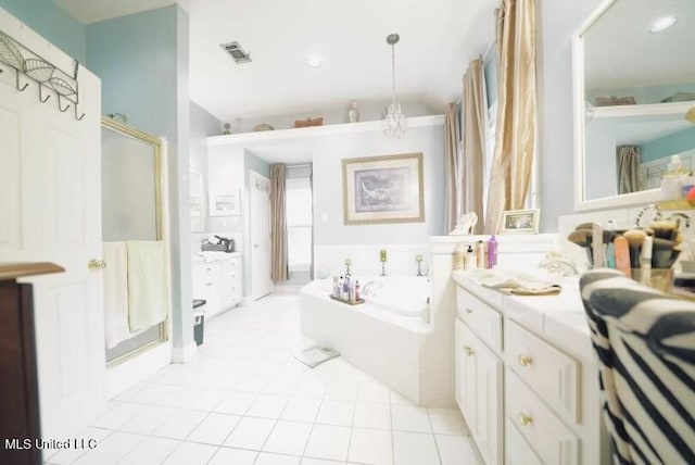 bathroom with tile patterned flooring, vanity, visible vents, a bath, and a shower stall