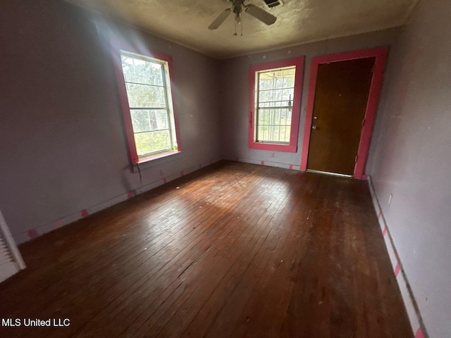 unfurnished room featuring hardwood / wood-style flooring and a ceiling fan