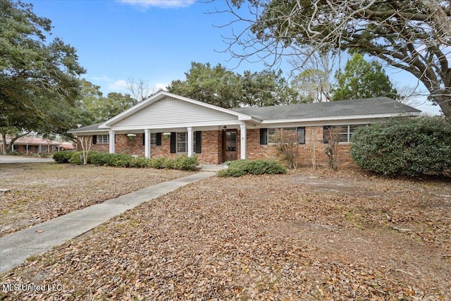 view of front of house with brick siding