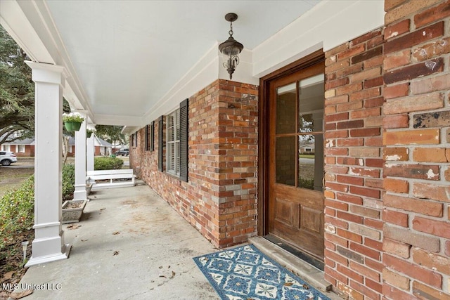 property entrance with brick siding