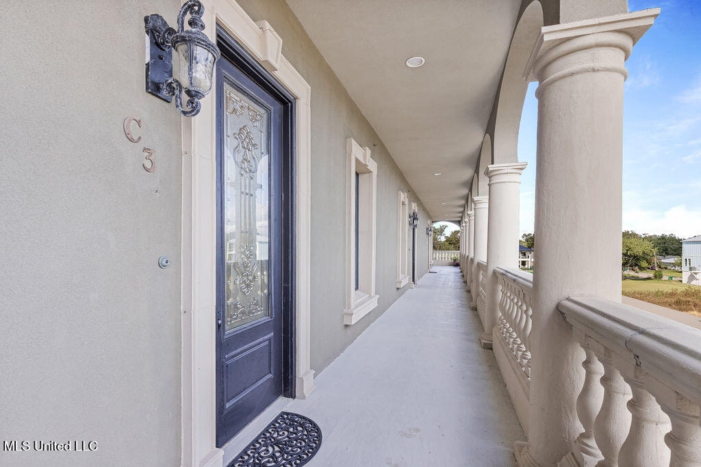4640 W Beach Blvd Unit C3, Gulfport, MS 39501 - view of exterior entry featuring a porch