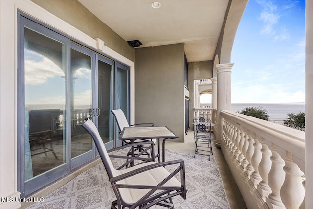 balcony featuring a water view