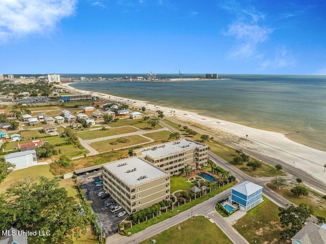 birds eye view of property with a view of the beach and a water view