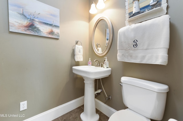 24000 Robert E Lee Rd, Lucedale, MS 39452 - half bath featuring toilet and tile patterned flooring