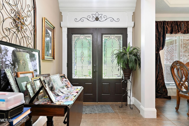 24000 Robert E Lee Rd, Lucedale, MS 39452 - foyer featuring french doors, light tile patterned floors, plenty of natural light, and ornamental molding