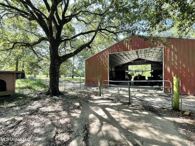 24000 Robert E Lee Rd, Lucedale, MS 39452 - view of patio with a pole building, an outbuilding, and a detached garage