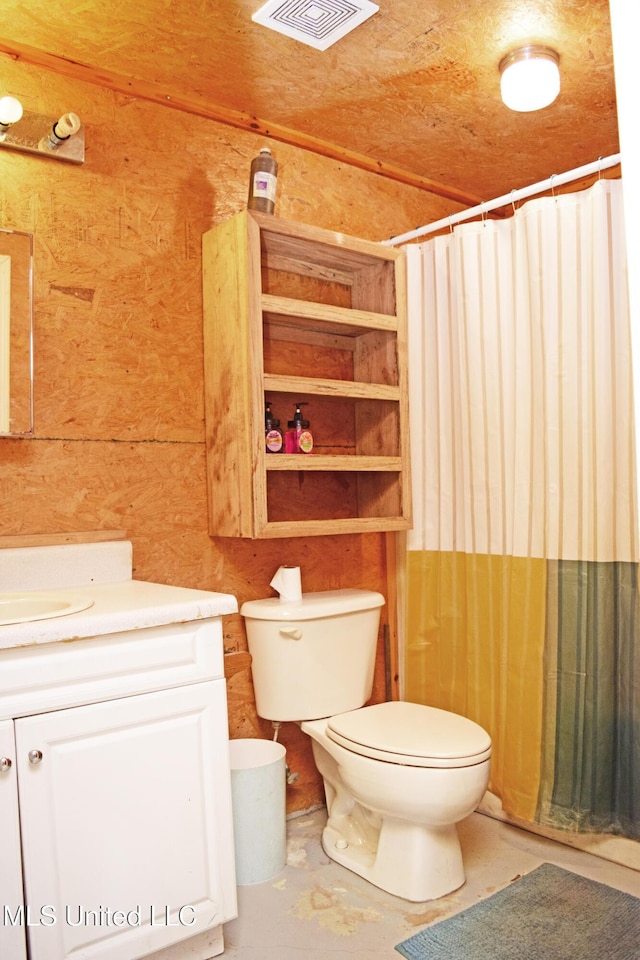 24000 Robert E Lee Rd, Lucedale, MS 39452 - bathroom with vanity, a shower with curtain, wood walls, and concrete floors