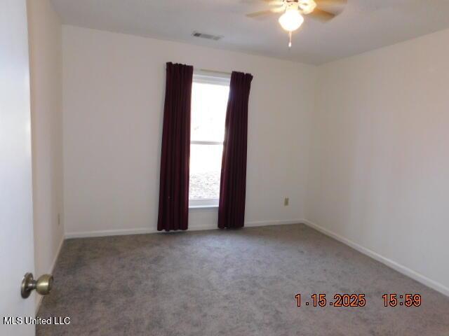 carpeted empty room with ceiling fan